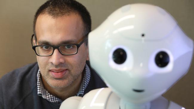 WSU senior lecturer and robots expert Dr Omar Mubin with Pepper. Picture: AAP IMAGE / Angelo Velardo