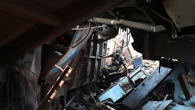 An army personnel conducting a search of the accident site which is now the country's deadliest rail accident in more than 20 years. Picture: AFP