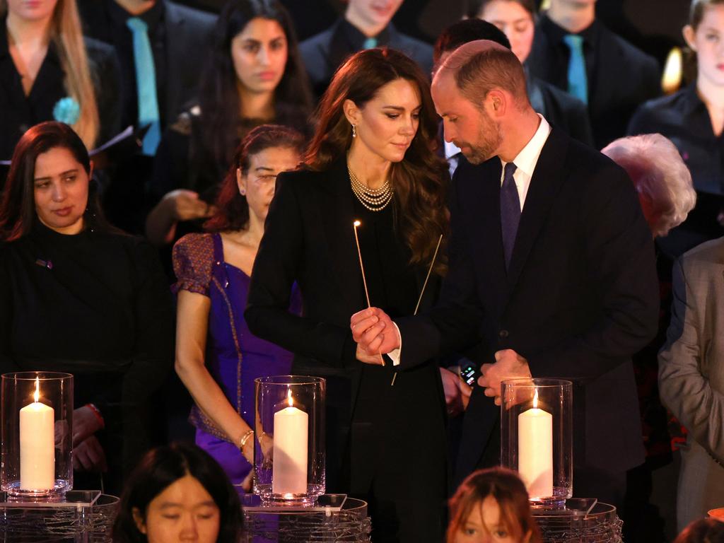 Prince William and Princess Catherine light candles during a ceremony commemorating Holocaust Memorial Day in London. Picture: Getty Images