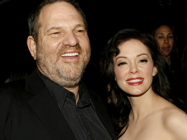 LOS ANGELES, CA - MARCH 26:  Producer Harvey Weinstein (L) and actress Rose McGowan arrive to the premiere of "Grindhouse" at the Orpheum Theatre on March 26, 2007 in Los Angeles, California.  (Photo by Kevin Winter/Getty Images)