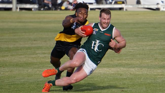 Imperials midfielder Bryce Hards attempts to escape a tackle in the round 3 Sunraysia football match against Red Cliffs at Mildura's Brian Weightman Oval. Picture: Michael DiFabrizio