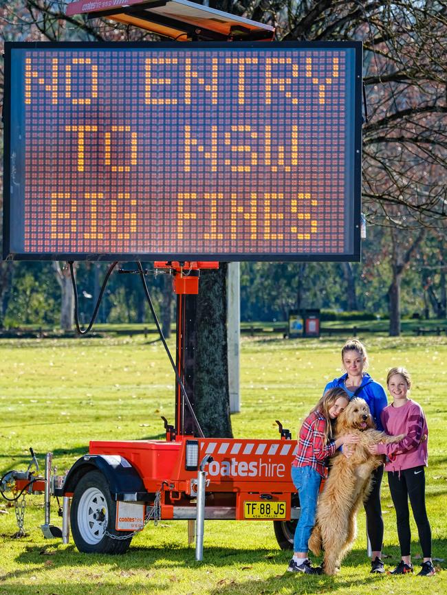 Albury residents Zarah Wright, Madison Wright, and their mother Kyra with their dog Bronte ahead of the border closure. Picture: Simon Dallinger/NCS NewsWire