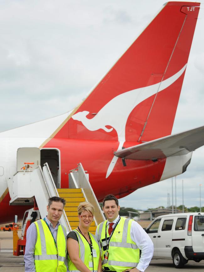 Waters early in his career at Qantas, pictured with Townsville airport general manager Kevin Gill and TEL business development executive Amanda Nass