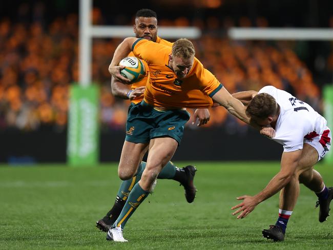 Reece Hodge shrugs a tackle against England.