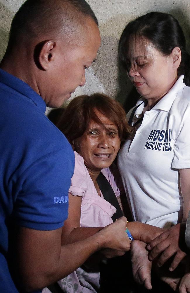 Filipino social workers arrest a street dweller during an operation in Manila. Picture: AP