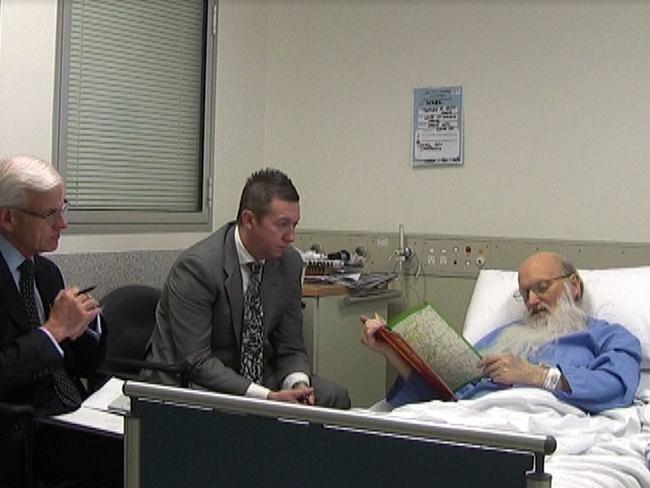 Deputy State Coroner Iain West (left) and Detective Inspector Wayne Newman during their failed attempt to get the dying and bed ridden Derek Percy to reveal where he disposed of murder victim Linda Stilwell’s body. Percy died a few days later.