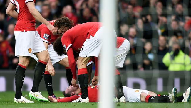 Wayne Rooney mobbed after his knock out celebration.