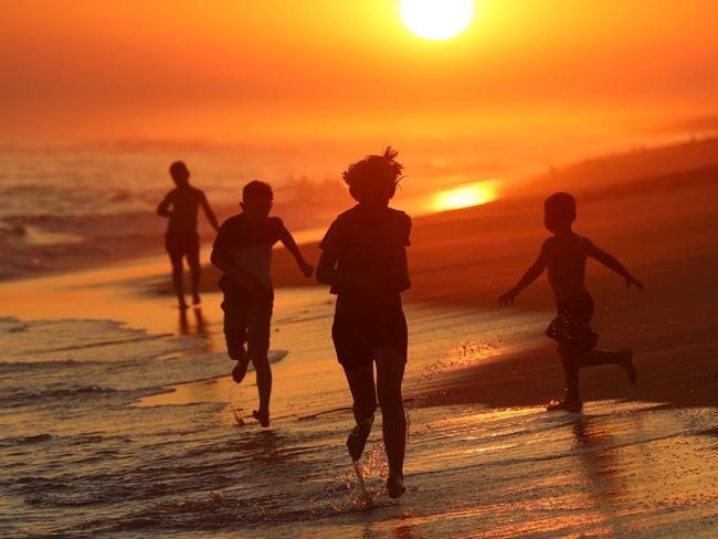 East Gippsland tourism in fire affected areas, in attempts to draw the crowds back to seaside locations and small country towns. Lakes Entrance. Generic sunset. Beach. Silhouette. kids playing.   Picture: Alex Coppel.