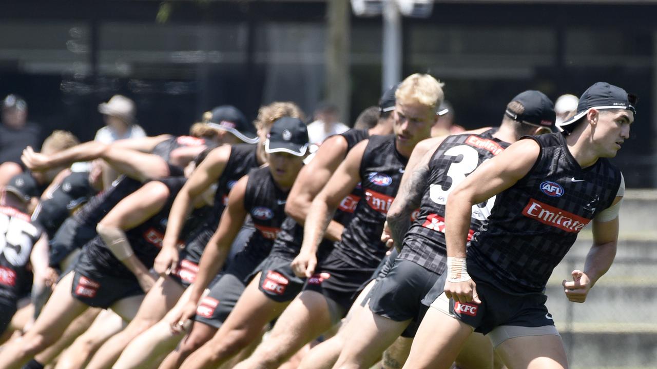 Collingwood players run drills at training. Picture: Andrew Henshaw