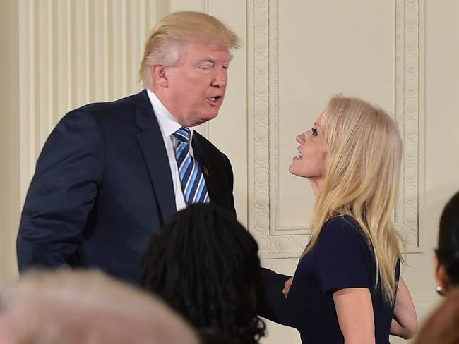 US President Donald Trump speaks with Kellyanne Conway after the swearing in of the White House senior staff. Picture: AFP Photo/Mandel Ngan