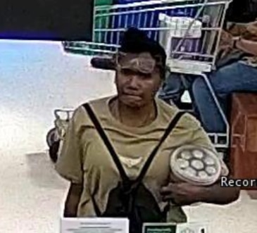 Police have released images from CCTV footage of a woman who may be able to assist police with their inquiries into stealing and fraud offences on August 13. Picture: QPS