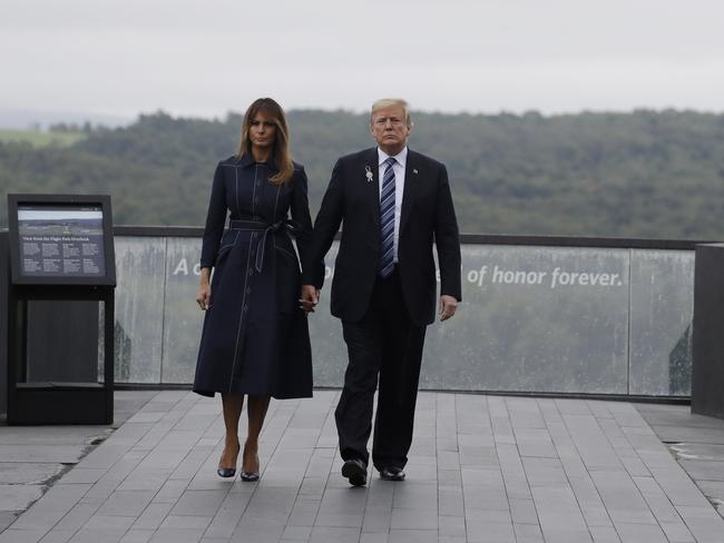 President Donald Trump and first lady Melania Trump, walk along the September 11th Flight 93 memorial today.