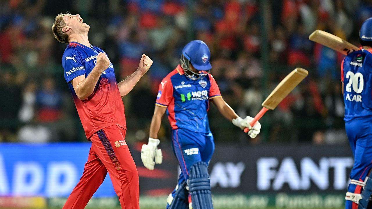 Cameron Green celebrates after taking the wicket of Delhi Capitals batter Rasikh Salam during Royal Challengers Bengaluru’s important IPL win on Sunday. Picture: Idrees Mohammed / AFP