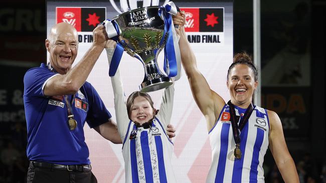 NCA. MELBOURNE, AUSTRALIA. 30th November 2024.  AFLW Grand Final. North Melbourne vs Brisbane at IKON Park, Carlton .  Captain Emma Kearney , coach Darren Crocker and Cup presenter  Imogen Mulgrew    .  Picture: Michael Klein