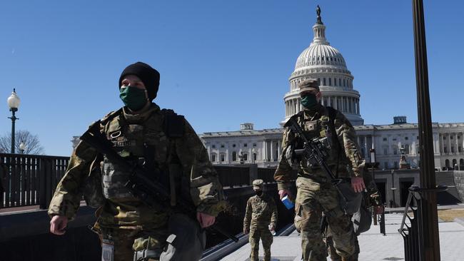 Members of the National Guard near the US Capitol Building in Washington on Thursday (AEDT) Picture: AFP