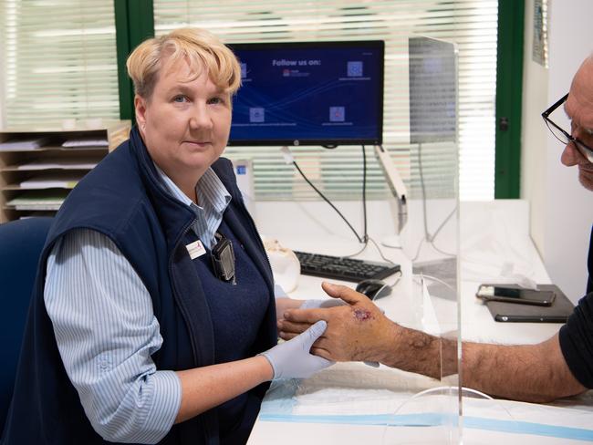 Clinical Nurse Consultant Kay Maddison Clinical Nurse Consultant, checks the wound of a patient who suffered a power saw injury to his hand. Picture: Monique Harmer