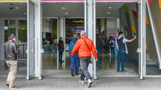 People entering the Wayville Covid-19 vaccination hub in Adelaide. Picture: NCA NewsWire /Brenton Edwards