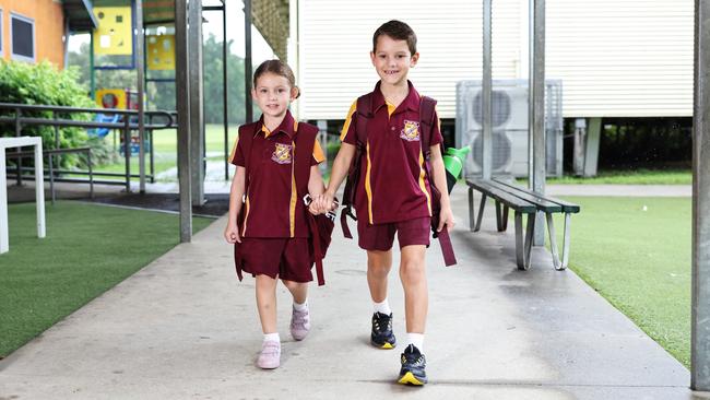 Max Thomas, 6, walks his sister Lyla Thomas, 4, to her prep class on her first day at Edge Hill State School. Picture: Brendan Radke