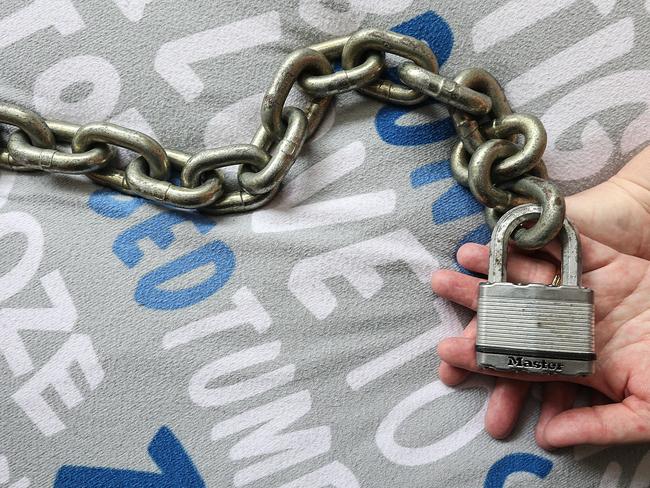 A ­wannabe Apex gangster’s mum holds the chain she and her husband sometimes used to chain to his bed to stop him from getting into trouble. Picture: Ian Currie