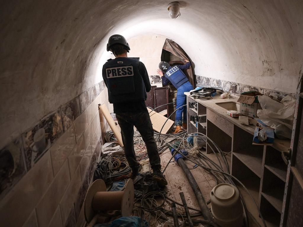 Journalists inside a tunnel that the army claimed is a "Hamas command tunnel" under a compound of the United Nations Relief and Works Agency for Palestine Refugees (UNRWA). Picture: AFP