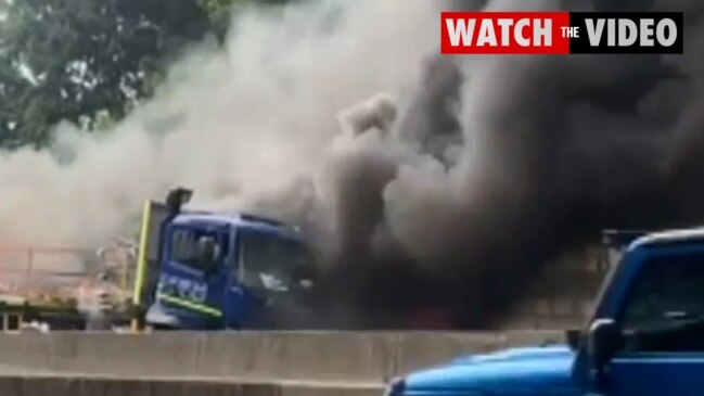 Truck bursts into flames causing peak hour traffic chaos (7NEWS)