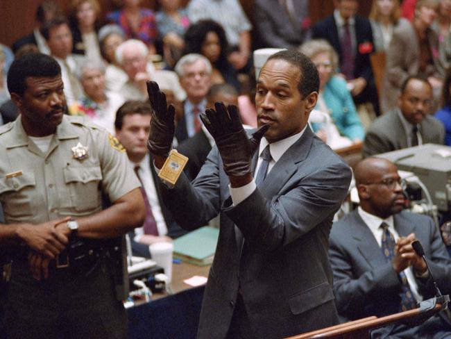 OJ Simpson and the infamous gloves during his trial for the murders of Nicole Brown Simpson and Ron Goldman. Picture: AFP