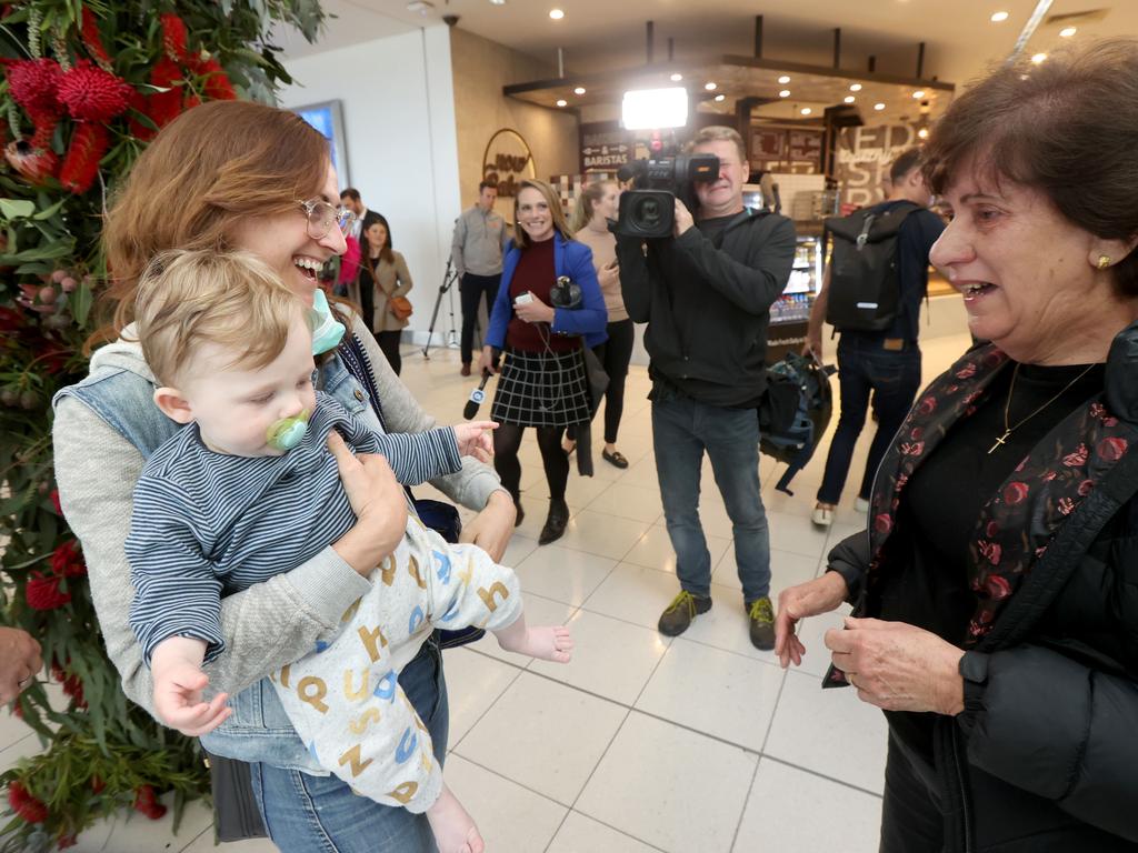 Denise Pride meet her Grandson Luca (8mths) with her Nina Lacey for the first time after the first plane from NSW landed at Adelaide Airport on Sunday.Picture: NCA NewsWire / Kelly Barnes