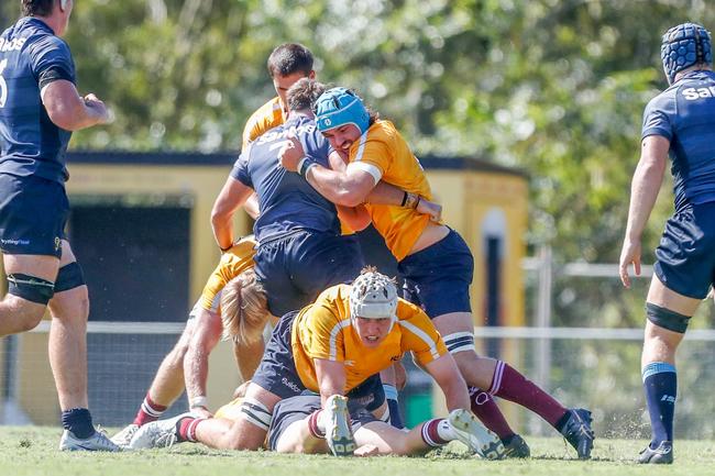 Charlie Cooke (blue headgear). Action from the Queensland Reds and New South Wales Waratahs under-20s academy bout. Picture: Stephen Archer.