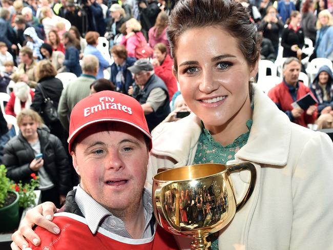 Melbourne Cup winning jockey Michelle Payne and her brother Steven pose for a photograph with the Melbourne Cup at a homecoming parade for winning horse Picture: AAP