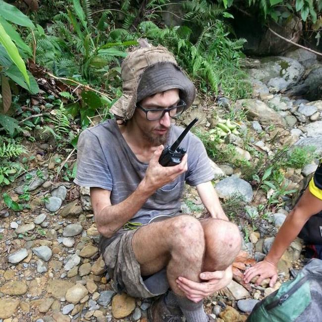 Andrew Gaskell talks to his father to tell him that he is alive, after being found in the Malaysia jungle. Picture:: Sarawak Fire and Rescue Department