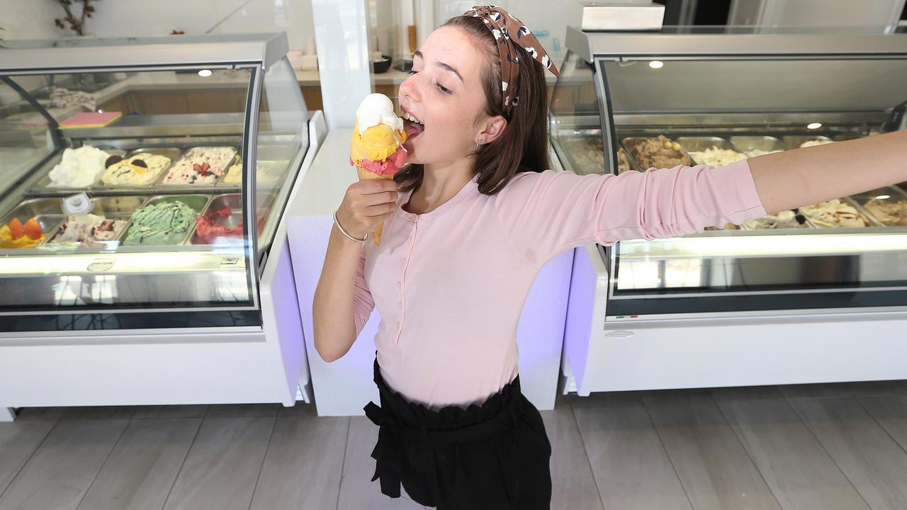 Busty girl selling ice-creams on the beach