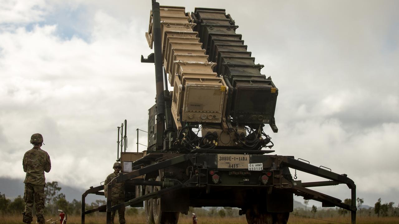 U.S. Army Sgt. Tamayo Ezekiel (right) and U.S. Army Private Pfc. Colby McCormick (left), Army Patriot Launching Station Enhanced Operators, raise the MIM-104 Patriot launching station Jul. 14, 2021, at Camp Growl in Queensland, Australia, during Exercise Talisman Sabre 2021. TS 21 supports the U.S. National Defense Strategy by enhancing our ability to protect the homeland and provide combat-credible forces to address the full range of potential security concerns in the Indo-Pacific. (U.S. Marine Corps photo by Lance Cpl. Alyssa Chuluda)