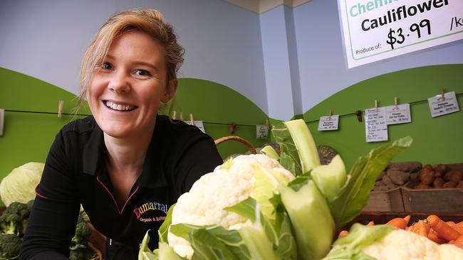 Eumarrah shop assistant Emily Rawlings with chemical-free cauliflowers