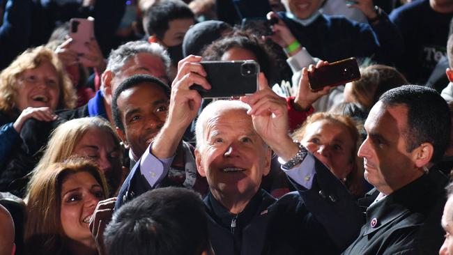 US President Joe Biden takes selfies with the crowd after a campaign event for Virginia Democratic gubernatorial candidate Terry McAuliffe in Arlington, Virginia. Picture: AFP