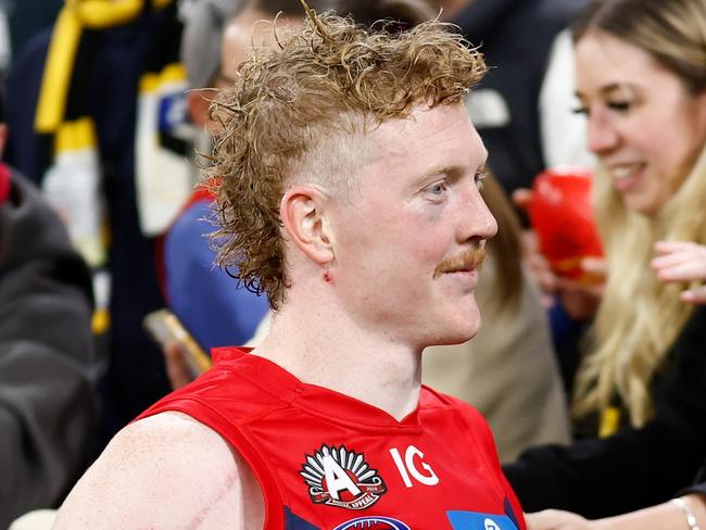 MELBOURNE, AUSTRALIA - APRIL 24: Clayton Oliver of the Demons celebrates with fans during the 2024 AFL Round 07 match between the Richmond Tigers and the Melbourne Demons at the Melbourne Cricket Ground on April 24, 2024 in Melbourne, Australia. (Photo by Michael Willson/AFL Photos via Getty Images)