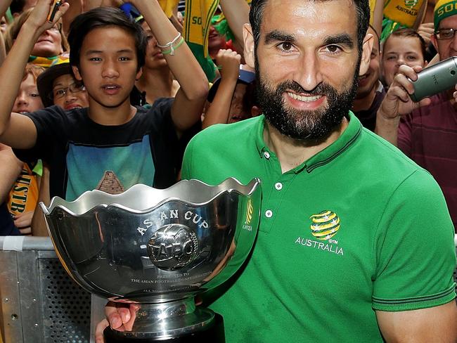 SYDNEY, AUSTRALIA - FEBRUARY 01: Socceroos captain Mile Jedinak poses with the Asian Cup during celebrations at Westfield Sydney on February 1, 2015, after the Socceroos won the 2015 Asian Cup last night, in Sydney, Australia. (Photo by Mark Metcalfe/Getty Images)