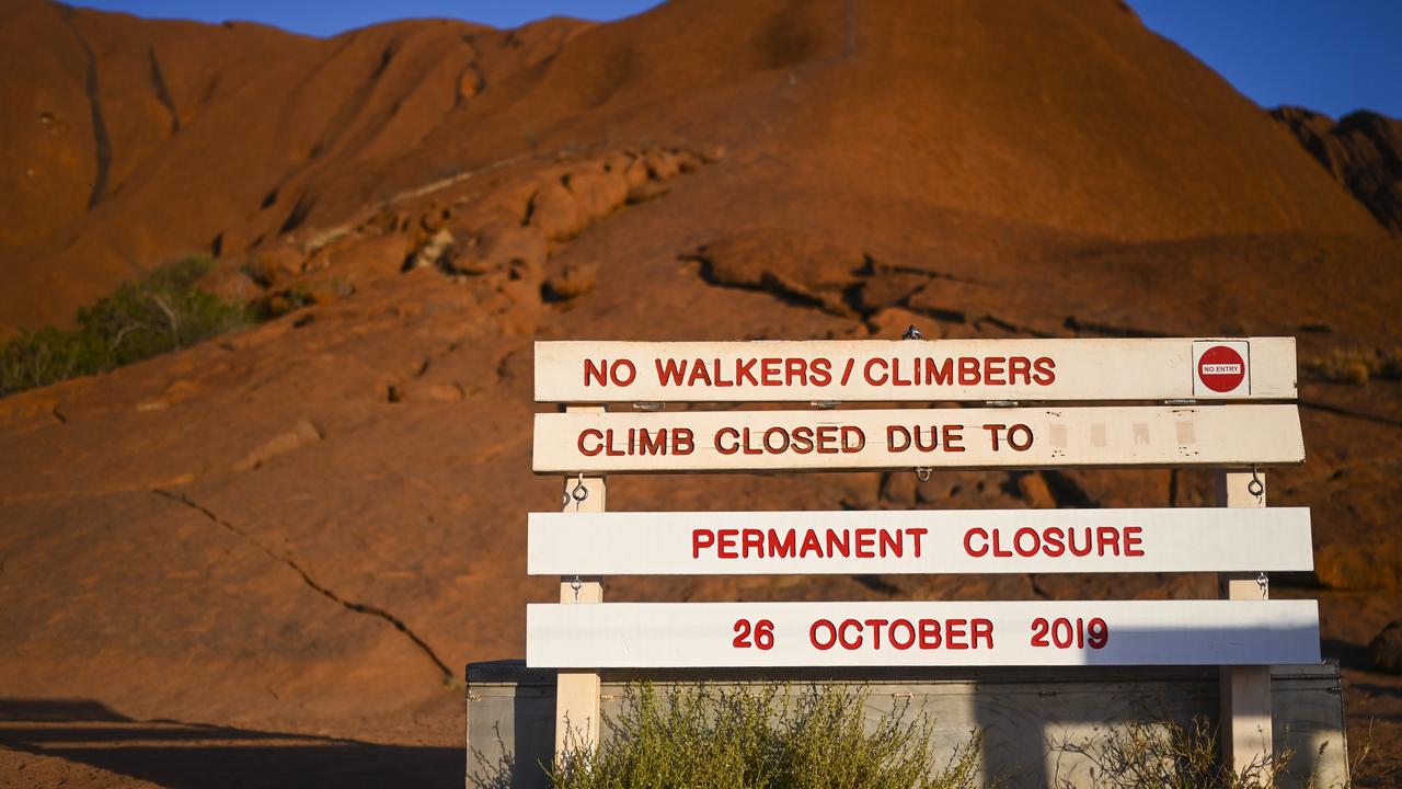 The newly installed sign indicating the permanent closure of the climb is seen at Uluru. Picture: AAP Image/Lukas Coch