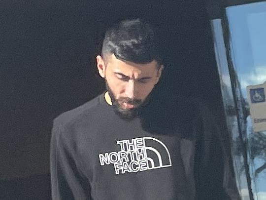 Hassan Abadi, 24, leaves Broadmeadows Magistrates' Court on Tuesday, after pleading guilty to possessing a prohibited weapon, drugs and driving unlicensed.