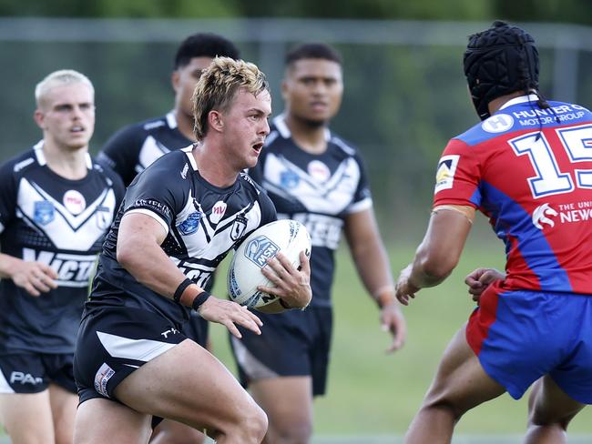 William Craig charges at Wailer Whaiapu. Picture: Michael Gorton