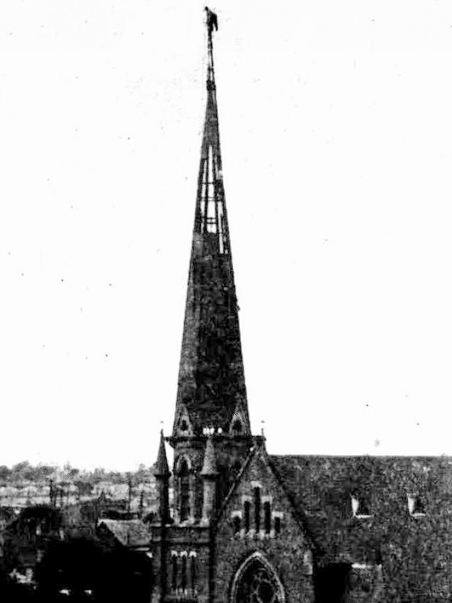 Steeplejack removing the spire in 1919.