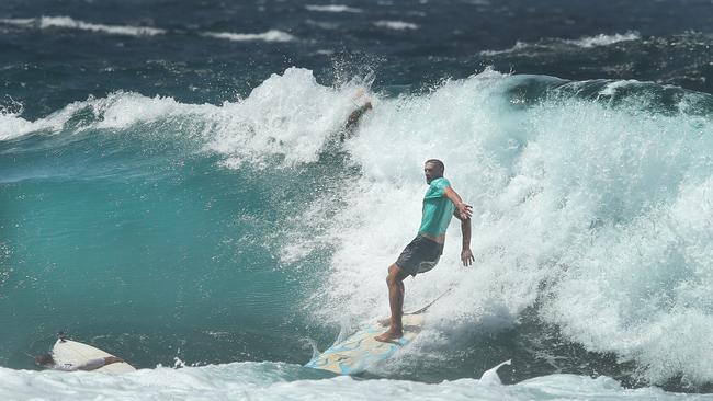 Powerful surf began hitting southern beaches this afternoon and locals hit the points before the pro surfers arrive. However there were a few casualties at Snappers Rocks. Local Declan Sheeran broke a rib avoiding a surfer in the impact zone. Picture: Glenn Hampson