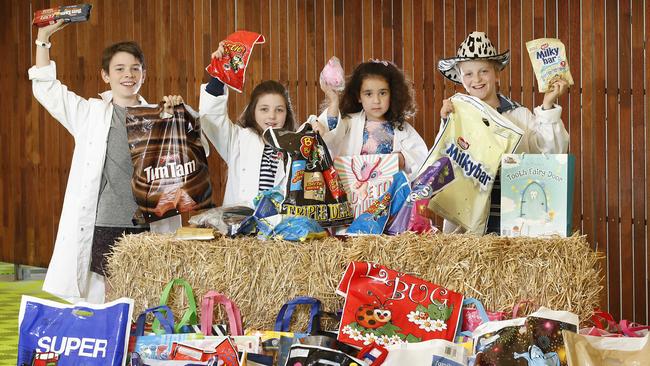 Jasper, 12, Ruby, 10, Paris, 3, and Josh, 11, get an early look at this year’s collection of Royal Melbourne Show showbags. Picture: David Caird