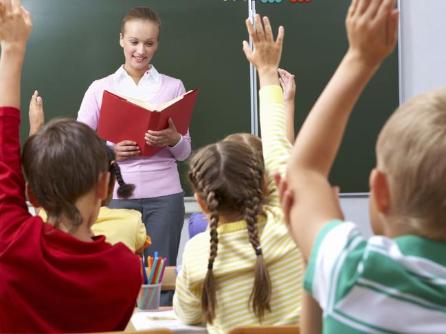 Generic image of teacher teaching students inside school classroom.