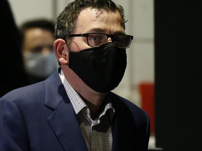 Premier of Victoria Daniel Andrews wears a mask as he arrives for a press conference. Picture: Getty