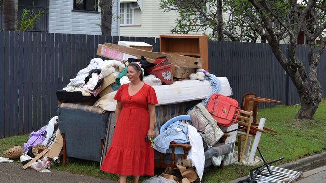 Dawn Kapernick with wrecked items from Merissa's house in Pimlico. Picture: Nikita McGuire