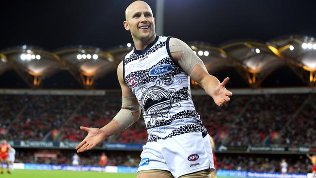 Gary Ablett celebrates a goal against his old team at Metricon Stadium.