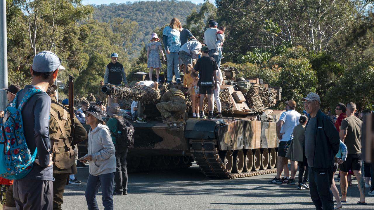 Members of the public have a close look at a M1A1 Abrams Main Battle Tank during a static display at the Gallipoli Barracks Open Day 2023. More than 18,000 members of the public registered to attend.