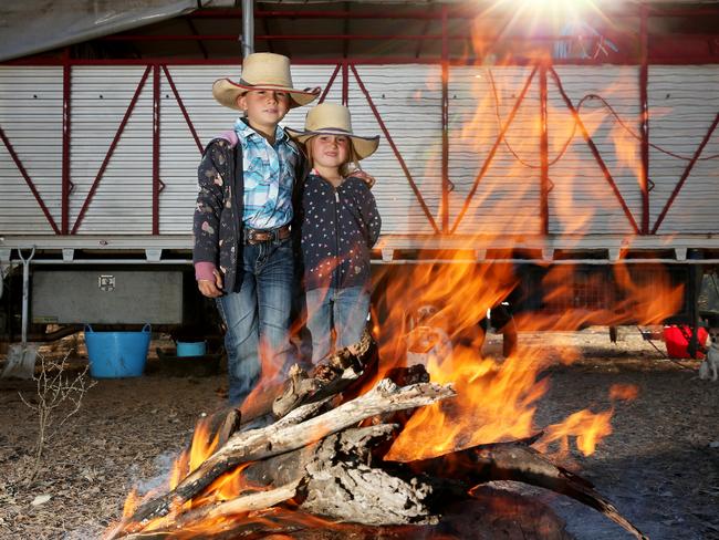 Uncertain times for droving youngsters Tori, 7, and Sienna Hourigan, who are schooled on the Long Paddock by droving parents Bek and Justin. Picture: Peter Lorimer