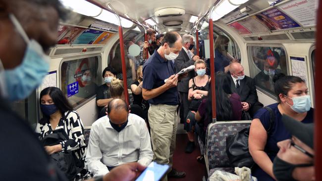 People wore masks on a London train line on Monday, as nearly all Covid-era restrictions were lifted in England. Picture: Getty