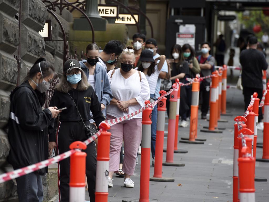 People queue for Covid tests at the Melbourne Town Hall. Picture: NCA NewsWire / Andrew Henshaw